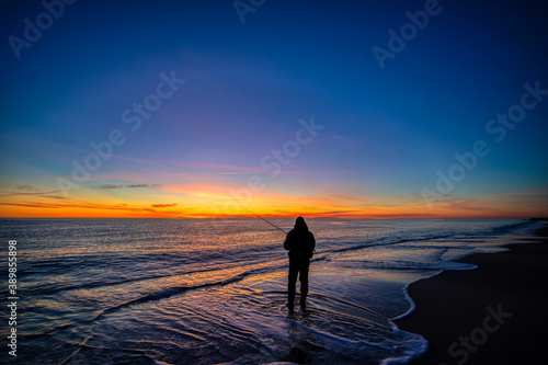 Fototapeta Naklejka Na Ścianę i Meble -  Fishing at sunrise.