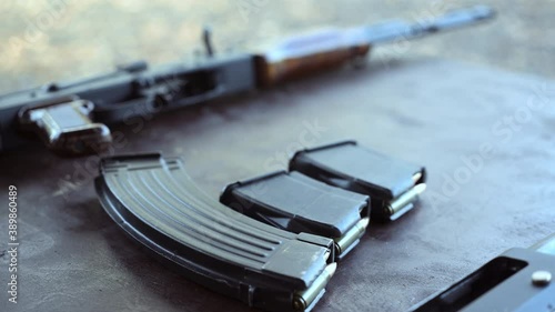 AK 47 Kalashnikov assault rifle and a magazine with bullets. Close-up.