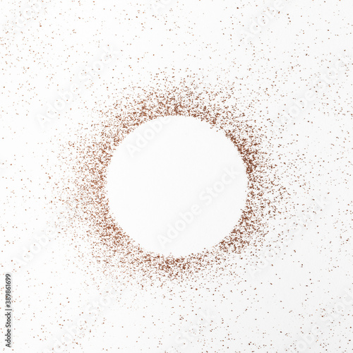 Coffee bean powder in a circle shape on white background top view
