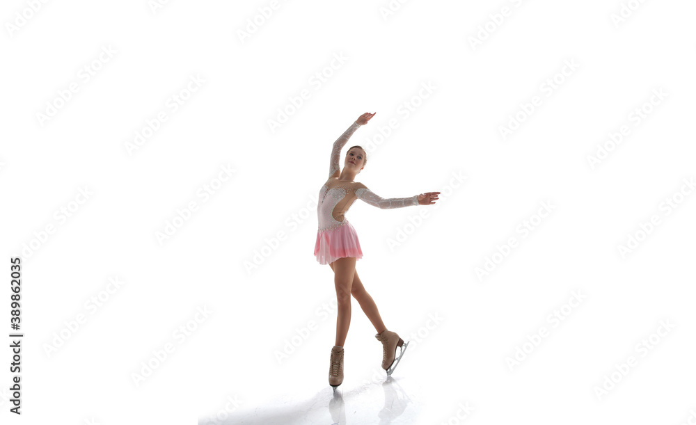 Obraz premium Figure skating girl in ice arena isolated on white.