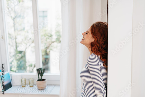 Happy young woman giggling and smiling Free Download Happy young woman giggling and smiling - GFXLoad