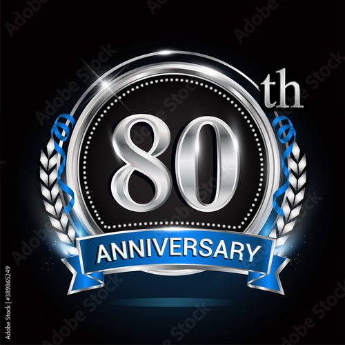 80th silver anniversary logo with blue ribbon and ring.
