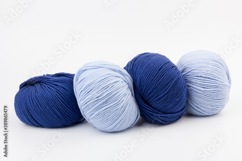 woolen merinos blue threads on white background. natural wool. knitting. background