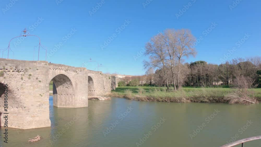PAN SHOT - The River Aude and Old Bridge (Pont Vieux, 14th Cent) leading to Medieval town of Carcassonne (Cité), Languedoc-Roussillon, France. PAN SHOT - The River Aude and Old Bridge (Pont Vieux, 14th Cent) leading to Medieval town of Carcassonne (Cité), Languedoc-Roussillon, France.
