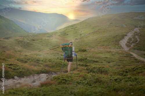 Hiker on the top in Carpathians mountains. Travel sport lifestyle concept.