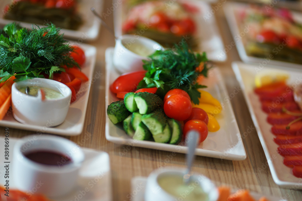 Fresh vegetables cut into strips with sauce and herbs are a treat for guests of the event Fresh vegetables cut into strips with sauce and herbs are a treat for guests of the event