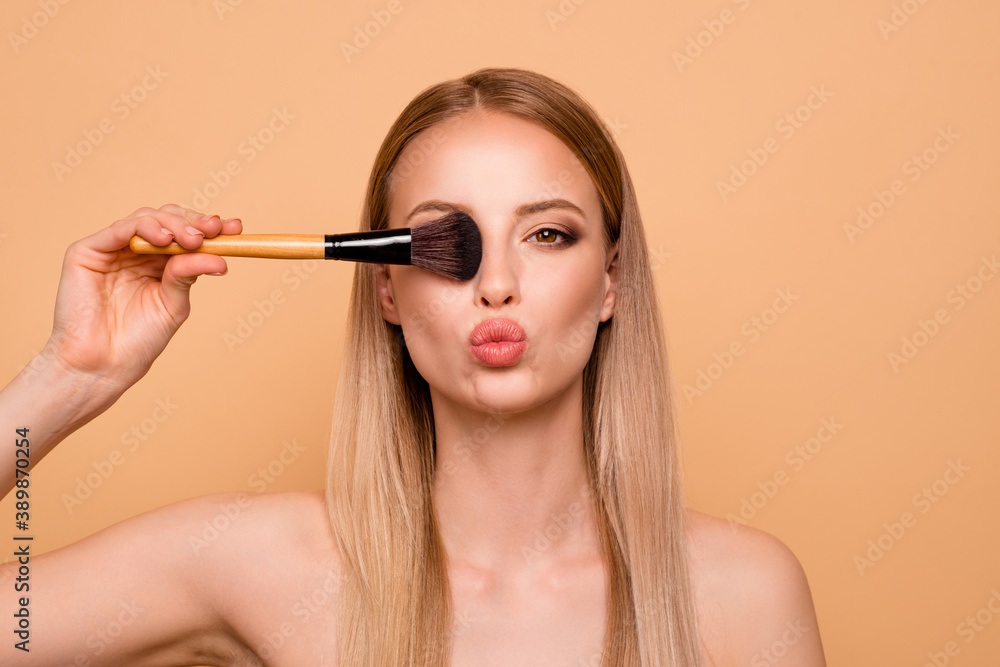 Obraz premium Close up photo charming elegant lady hold hand feel romance romantic hide eyes attract boys send air kisses blow vogue stylish cosmetologist complexion stylist visagiste she isolated beige background