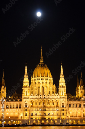 Hungarian parliament building at full moon night 