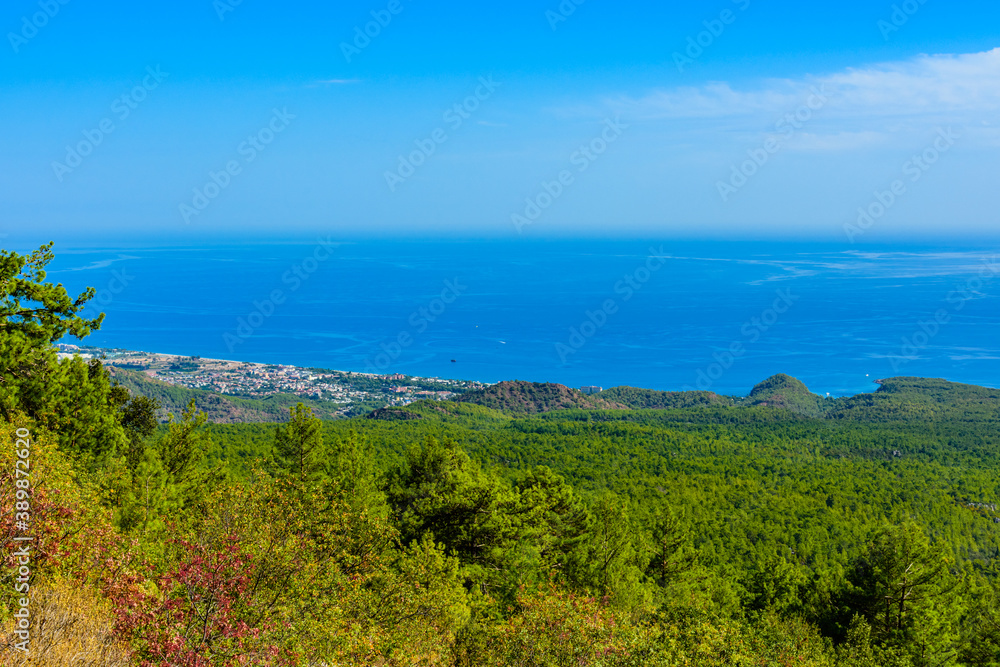 View on Mediterranean sea and village from the summit of Tahtali mountain View on Mediterranean sea and village from the summit of Tahtali mountain
