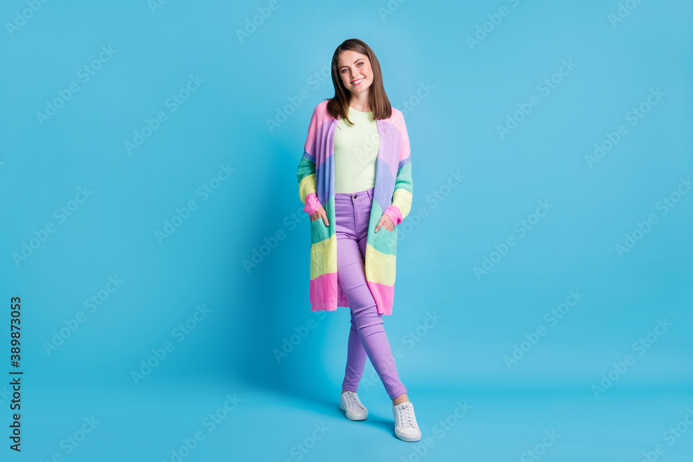 Full length photo of cute sweet woman dressed casual colorful outfit hands arms pockets isolated blue color background