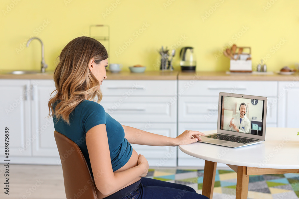 Young pregnant woman video chatting with doctor at home Young pregnant woman video chatting with doctor at home
