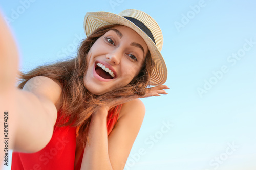 Beautiful young woman takin...