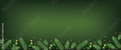 Green Christmas and New Year background with fir tree border, and xmas balls ornament decoration