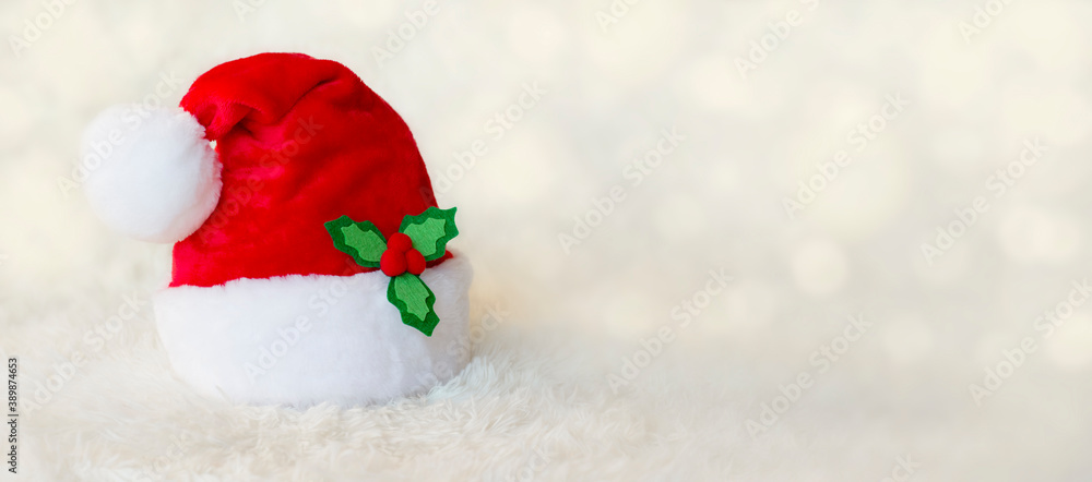 Santa Claus hat on a light background with space for text. Santa Claus hat on a light background with space for text.