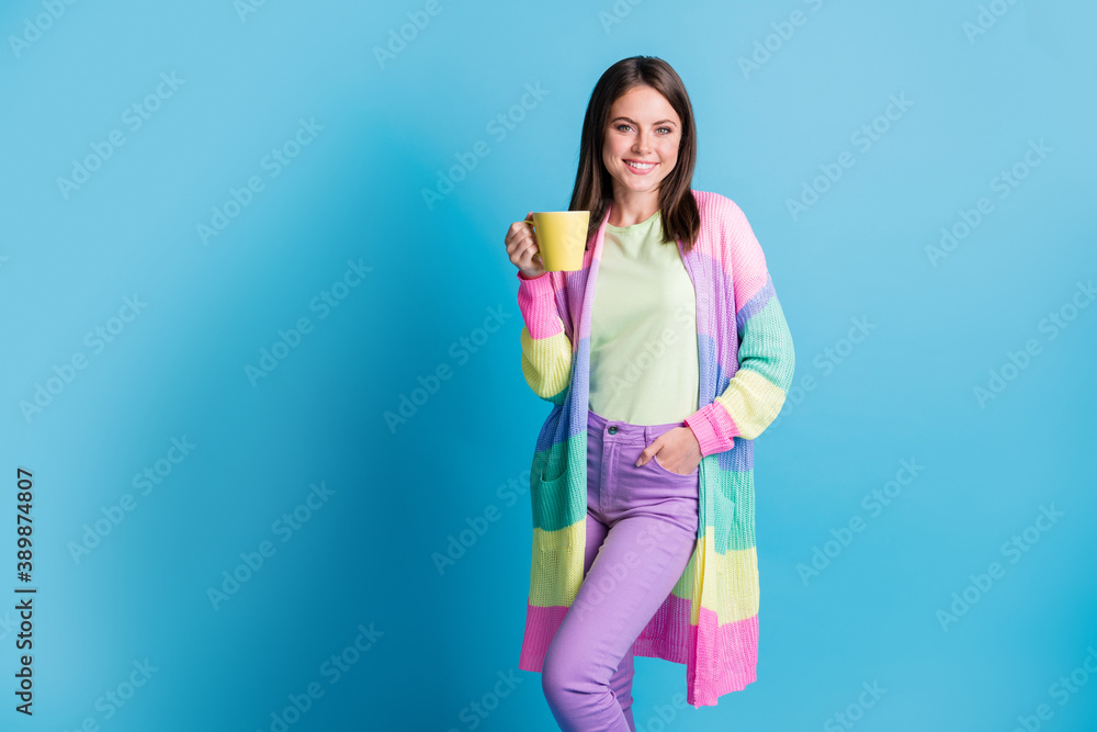 Photo of pretty brown haired woman autumn season relax hold hot mug isolated on shine blue color background Photo of pretty brown haired woman autumn season relax hold hot mug isolated on shine blue color background