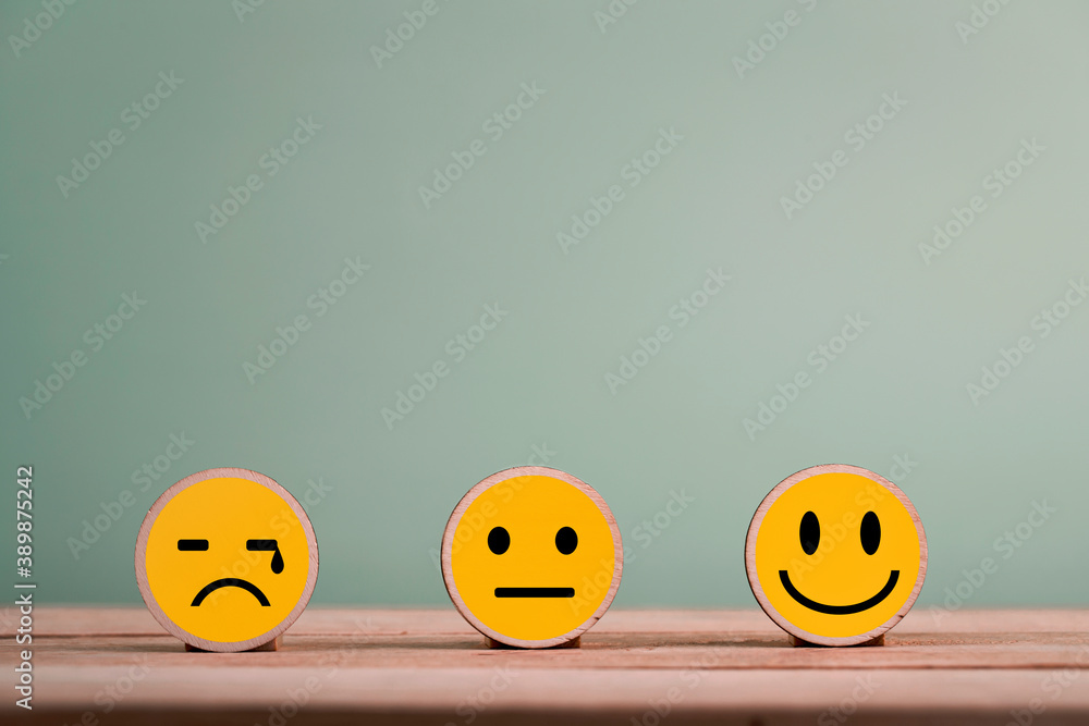 Happy smile face emoticon icons on Wooden Cube , good feedback rating for customer review survey Happy smile face emoticon icons on Wooden Cube , good feedback rating for customer review survey