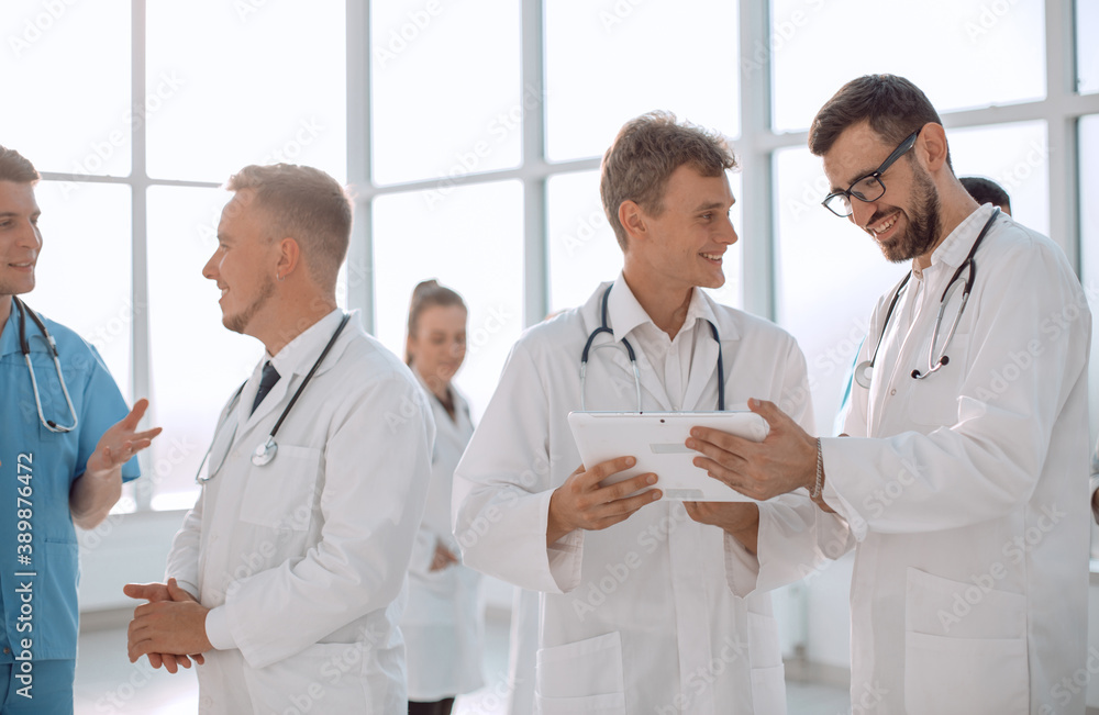 medical professionals looking at the screen of a digital tablet medical professionals looking at the screen of a digital tablet