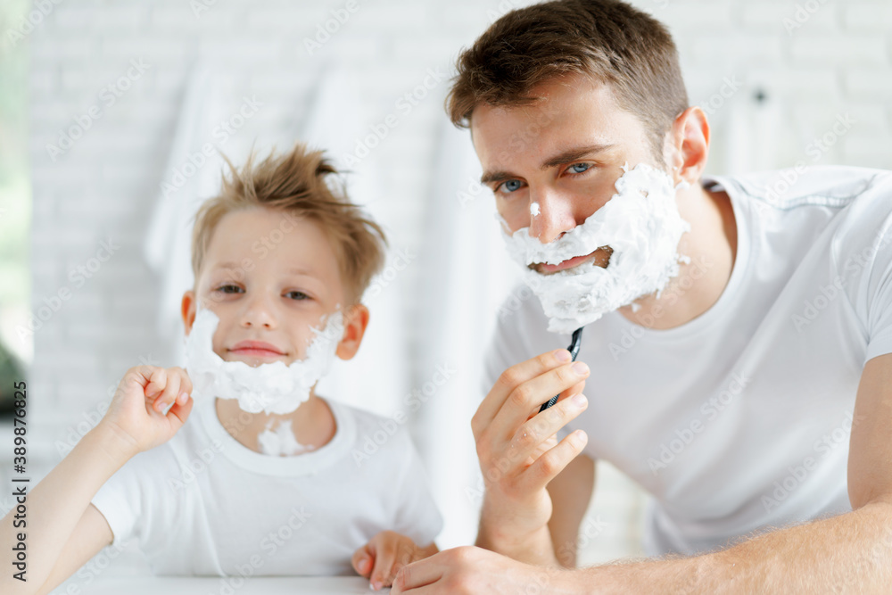 Father and his little son shaving together