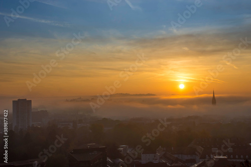 Cityscape of Graz with Church of the Sacred Heart of Jesus and historic buildings, in Graz, Styria region, Austria, at sunrise. Beautiful foggy morning over the city of Graz, in autumn