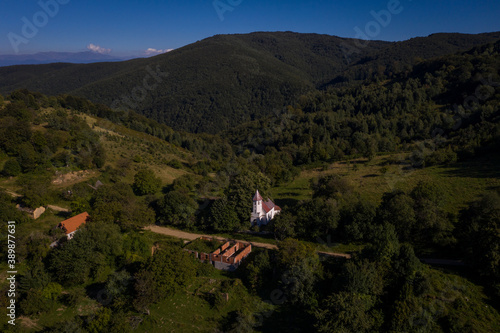 Aerial drone photograph with Lindenfeld deserted village in Semenic Mountains, Romania. The last inhabitant of the village, Paul Schwirzenbeck, died in 1998. photo