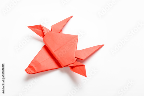 Origami bull as symbol of year 2021 on white background