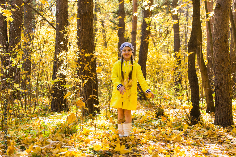 Little girl playing with her dog in autumn forest. Child and jack russell terrier dog. Little girl playing with her dog in autumn forest. Child and jack russell terrier dog.