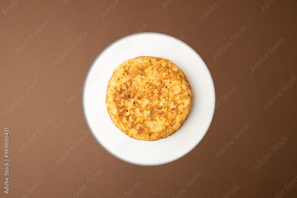 omelette with potatoes on brown background omelette with potatoes on brown background