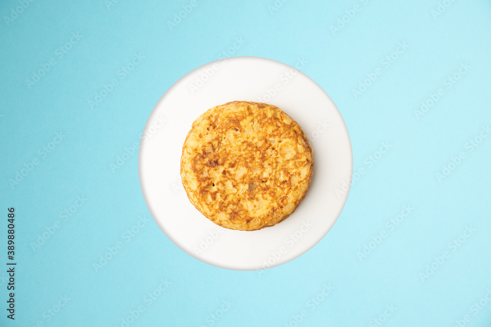 omelette with potatoes on blue background omelette with potatoes on blue background