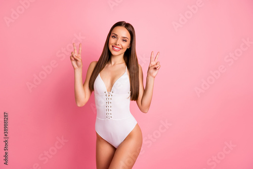 Portrait of her she nice-looking attractive lovely charming pretty winsome perfect cheerful cheery optimistic straight-haired lady showing double v-sign isolated over pink pastel background