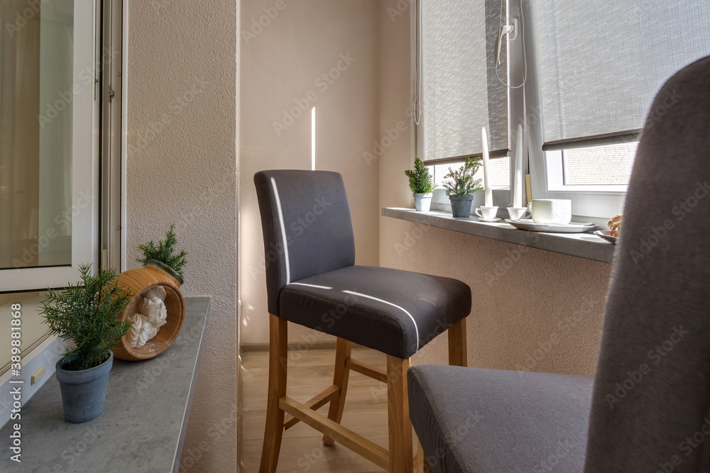 Fototapeta premium dinner tea table with chairs on the loggia in light interior