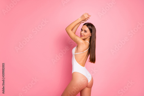 Profile side view portrait of her she nice-looking attractive lovely lovable winsome perfect charming delicate straight-haired lady posing isolated over pink pastel background