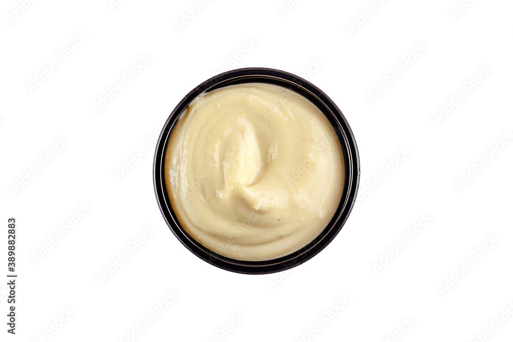 Sauce garlic in a plastic disposable dish on a white background, top view. Isolated Sauce garlic in a plastic disposable dish on a white background, top view. Isolated