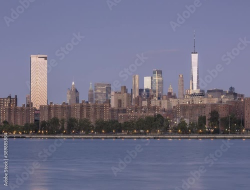 Downtown Manhattan view from East river in the night to day time lapse