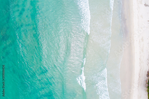 Clear sea water on sand beach aerial view