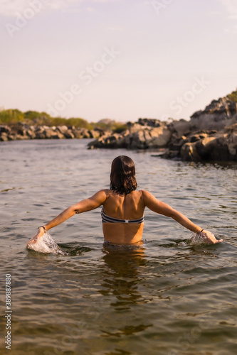 A young tourist bathing in the water of a Nubian village on the river Nile and near the city of Aswan. Egypt