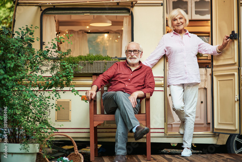 Happy elderly married couple near their camper van © Friends Stock