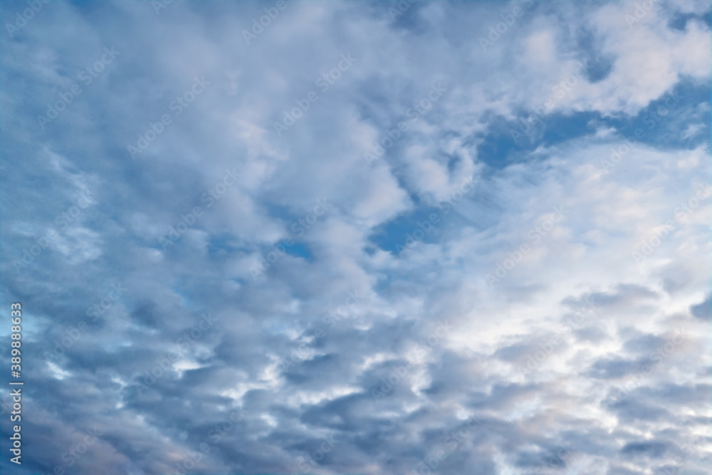 Blue summer sky with white cumulus clouds. Blue sky with clouds nature background. Blue summer sky with white cumulus clouds. Blue sky with clouds nature background.
