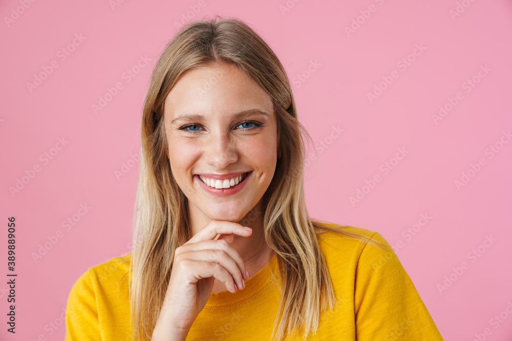 Cheerful beautiful girl smiling while looking at camera Cheerful beautiful girl smiling while looking at camera