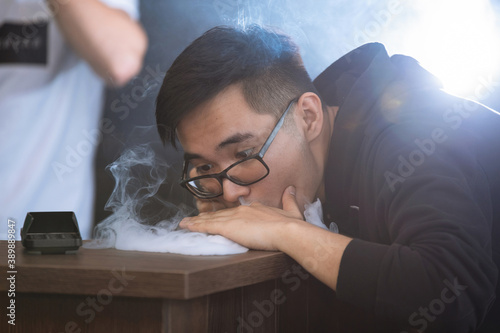 Man blows smoke