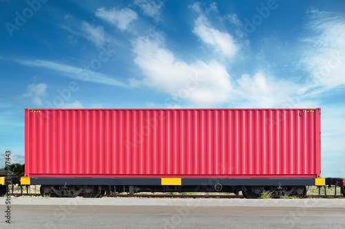 Freight Train with Cargo Containers, Transport, Shipping import Export on blue sky background