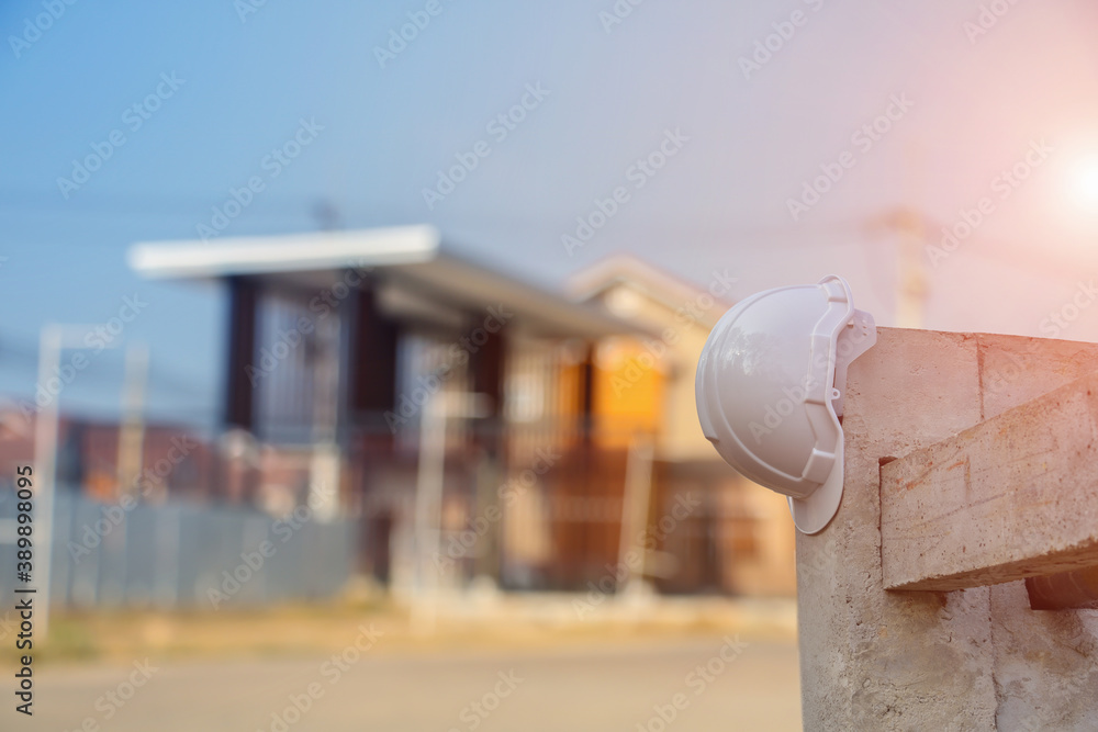 Safety first project of worker as engineer or worker or crew and insurance, business concept, construction safety, white hard safety helmet on concrete floor on City Safety first project of worker as engineer or worker or crew and insurance, business concept, construction safety, white hard safety helmet on concrete floor on City
