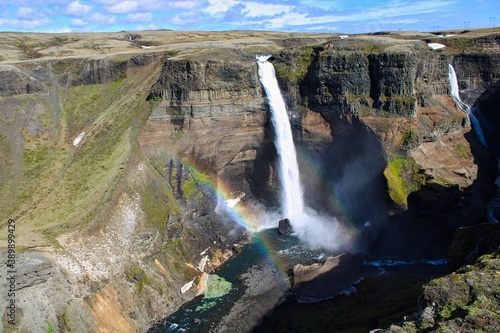 The beautiful Haifoss waterfall in the Icelandic Highlands on a wonderful day with sunshine and blue sky in summer