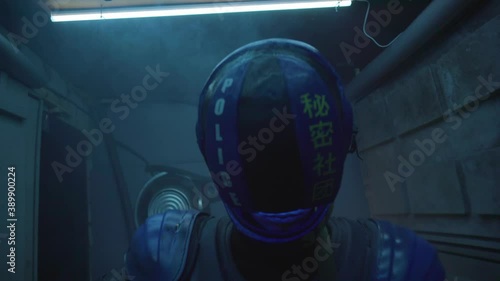 Cyberpunk concept, future world. Police officer halfman bionic cyborg or android with weapon gun in hand at night. Science fiction scene, fantasy, sci. Neon lighting. Smoke in the corridor photo