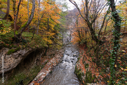 Bigar Waterfall in the Romanian mountains - amazing view of one of the most beautiful waterfalls in Europe during an autumn day with great fall colors