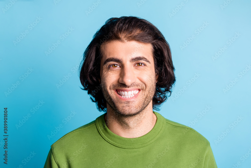 Fototapeta premium Close up photo of delighted bearded person smile look camera wear pullover isolated on blue color background