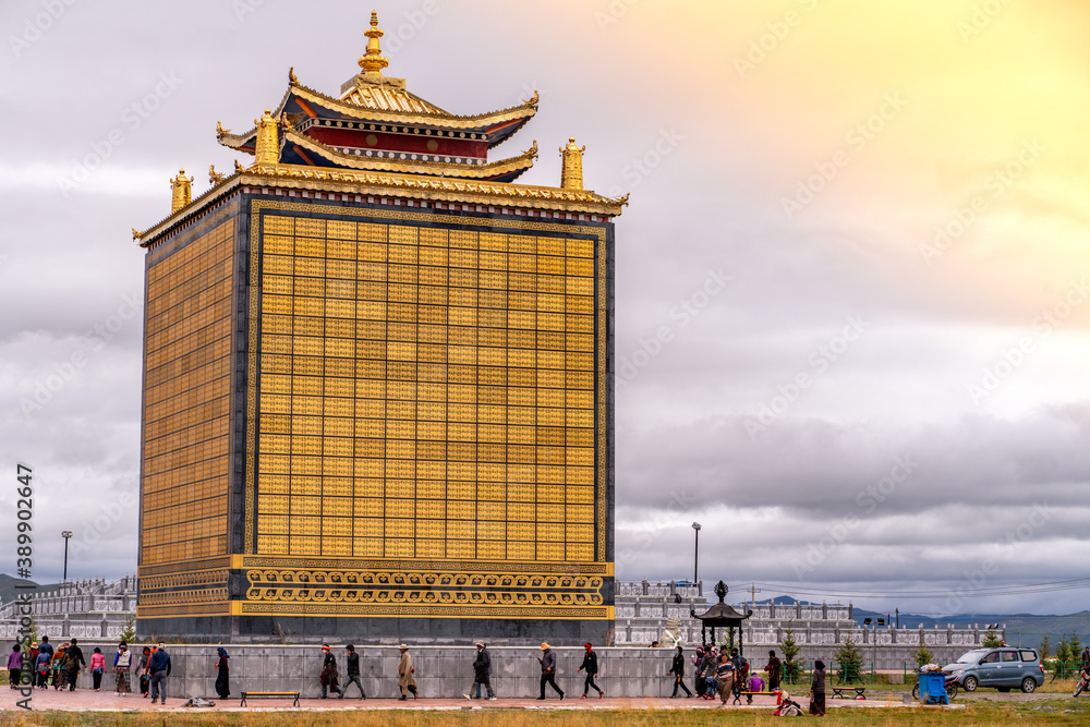 The big golden rolling prayer drum in the tibetan buddhist monastery ...