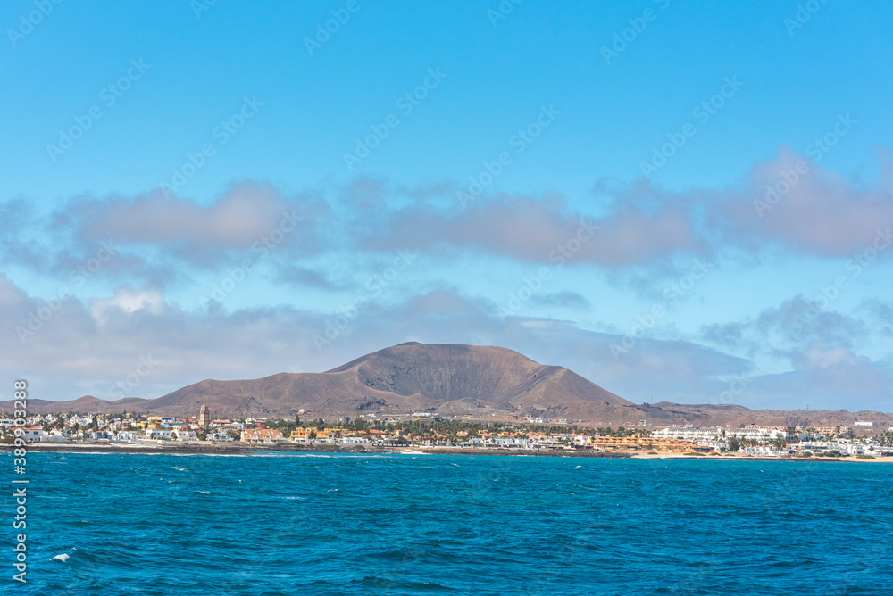 Sunny day in Corralejo from the sea in Fuerteventura on the Canary Islands in Spain. Sunny day in Corralejo from the sea in Fuerteventura on the Canary Islands in Spain.