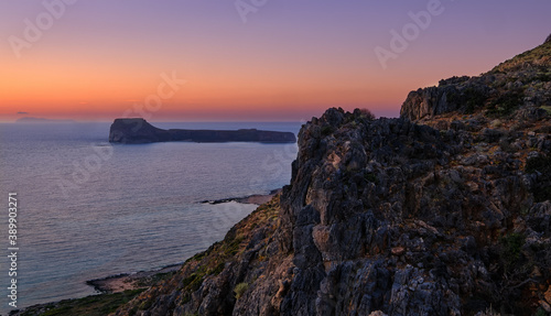 Sunset view of Gramvousa islet behind the rocky hills of Balos beach area  Crete  Greece.
