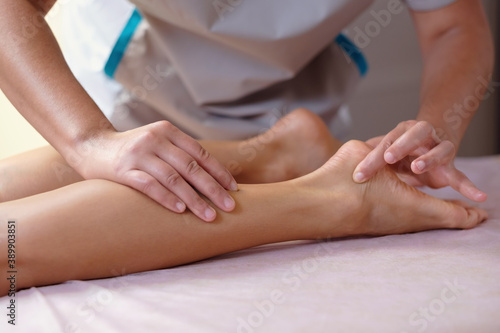 Caucasian woman receiving a leg massage on spa therapy. Healthcare concept.