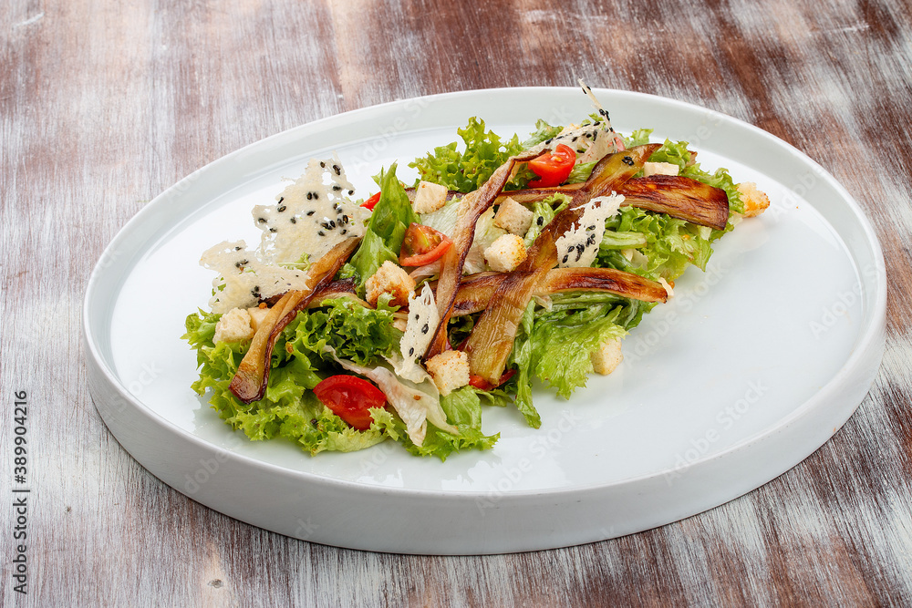 Salad with baked eggplant, mozzarella and romaine lettuce Salad with baked eggplant, mozzarella and romaine lettuce